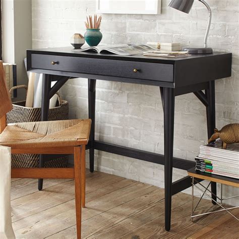 Compact and clean-lined, this desk has ample tabletop space for a laptop, notepad and books, plus a full-width drawer for. . West elm mid century mini desk